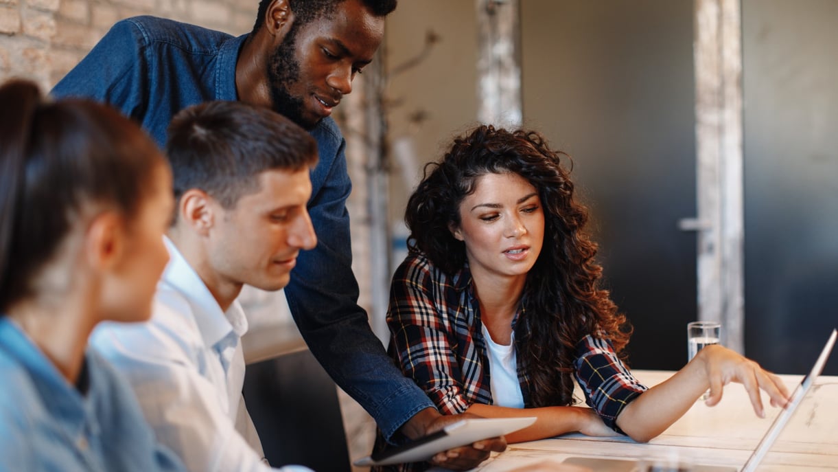 A team sitting in a meeting together