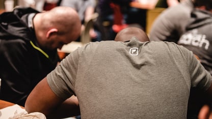 A group of men pray together
