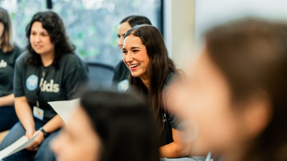 Woman smiles during team meeting
