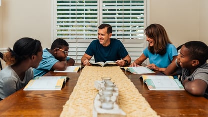 A family sits around a table
