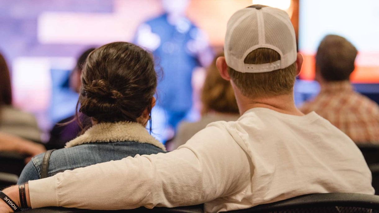 A married couple sitting together at church