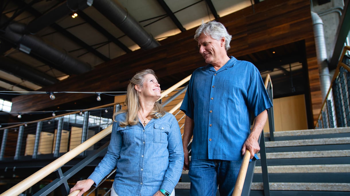 A couple walking down a flight of stairs