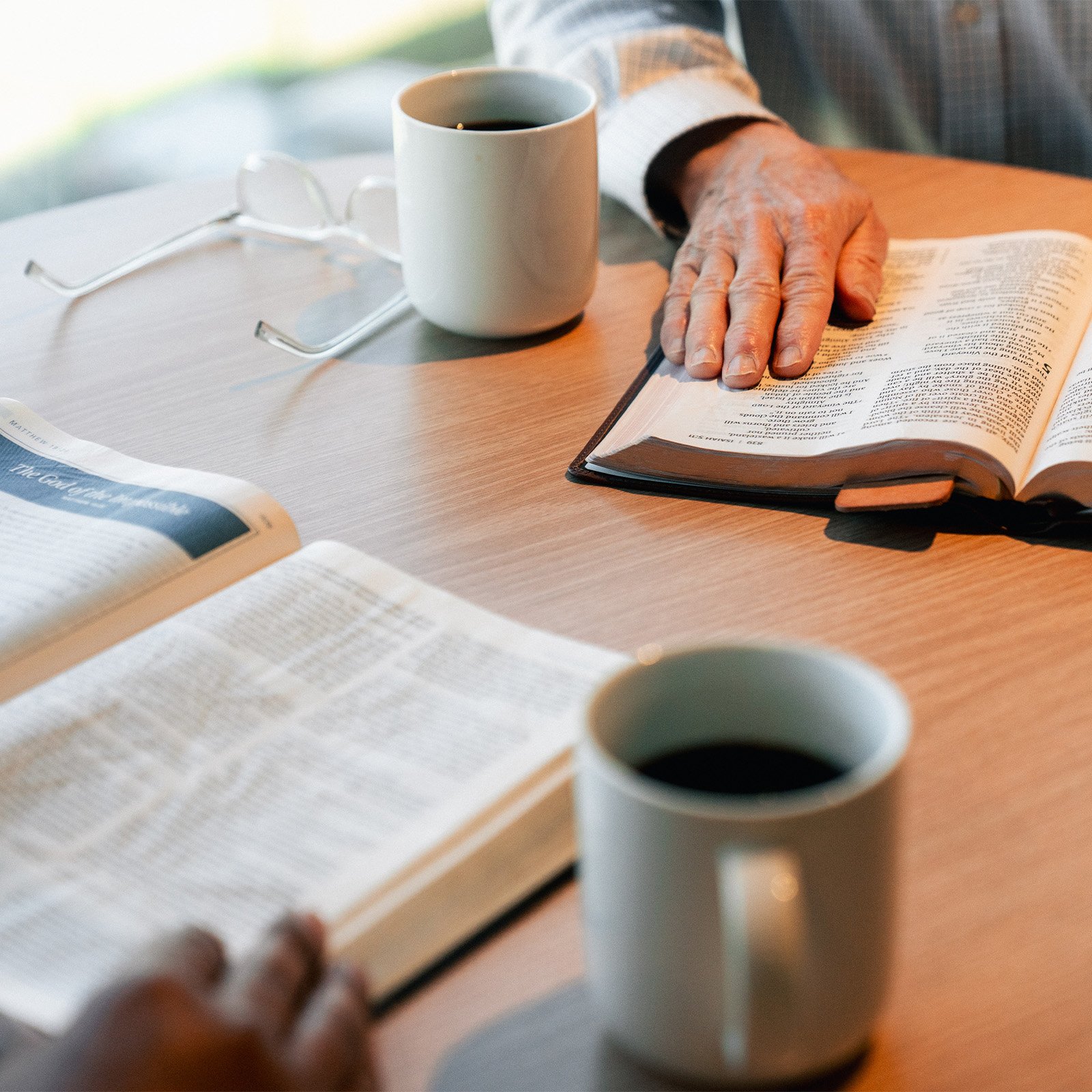 Two people reading the Bible together
