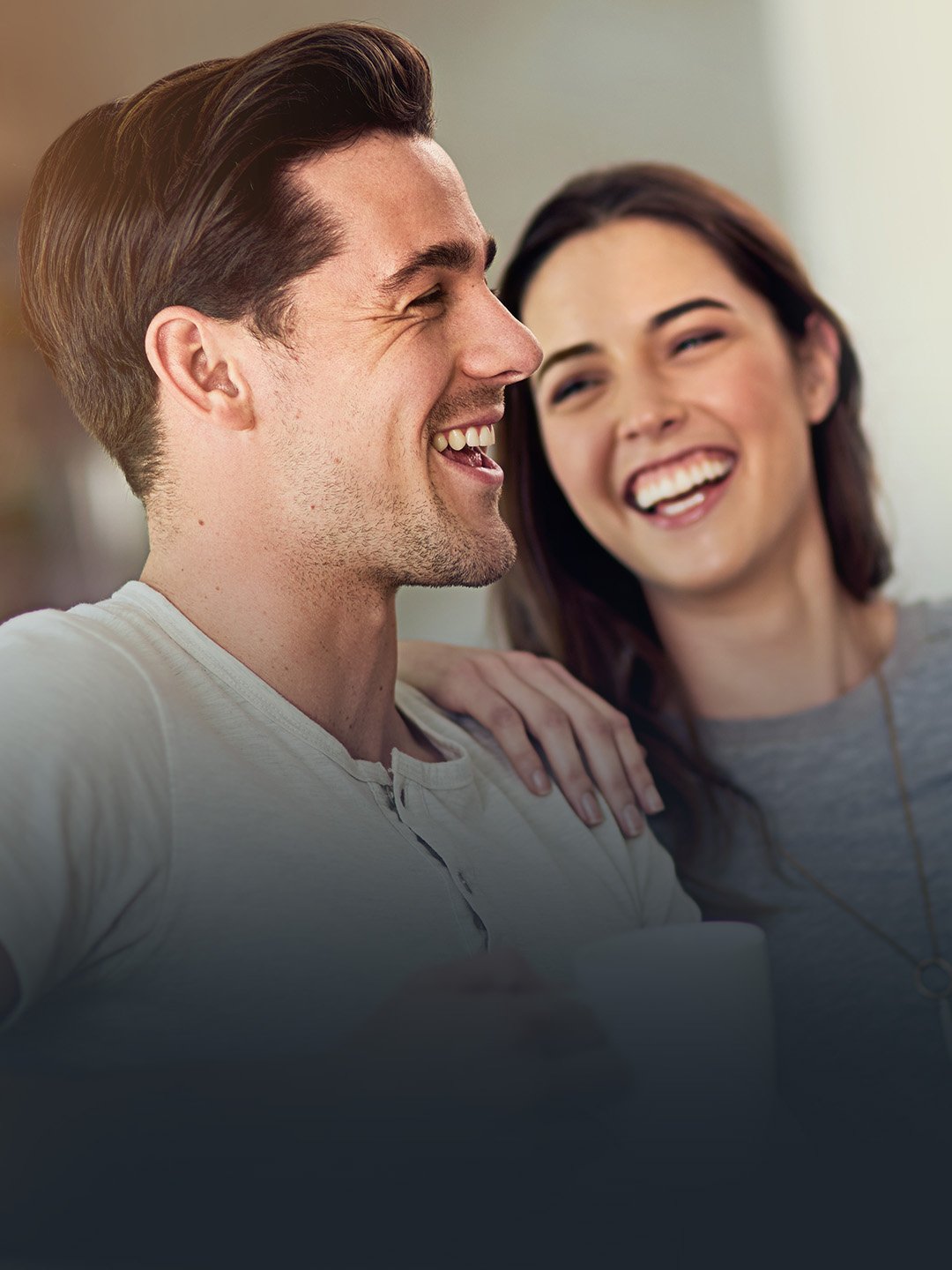 A Foundation Group couple smiling at one another