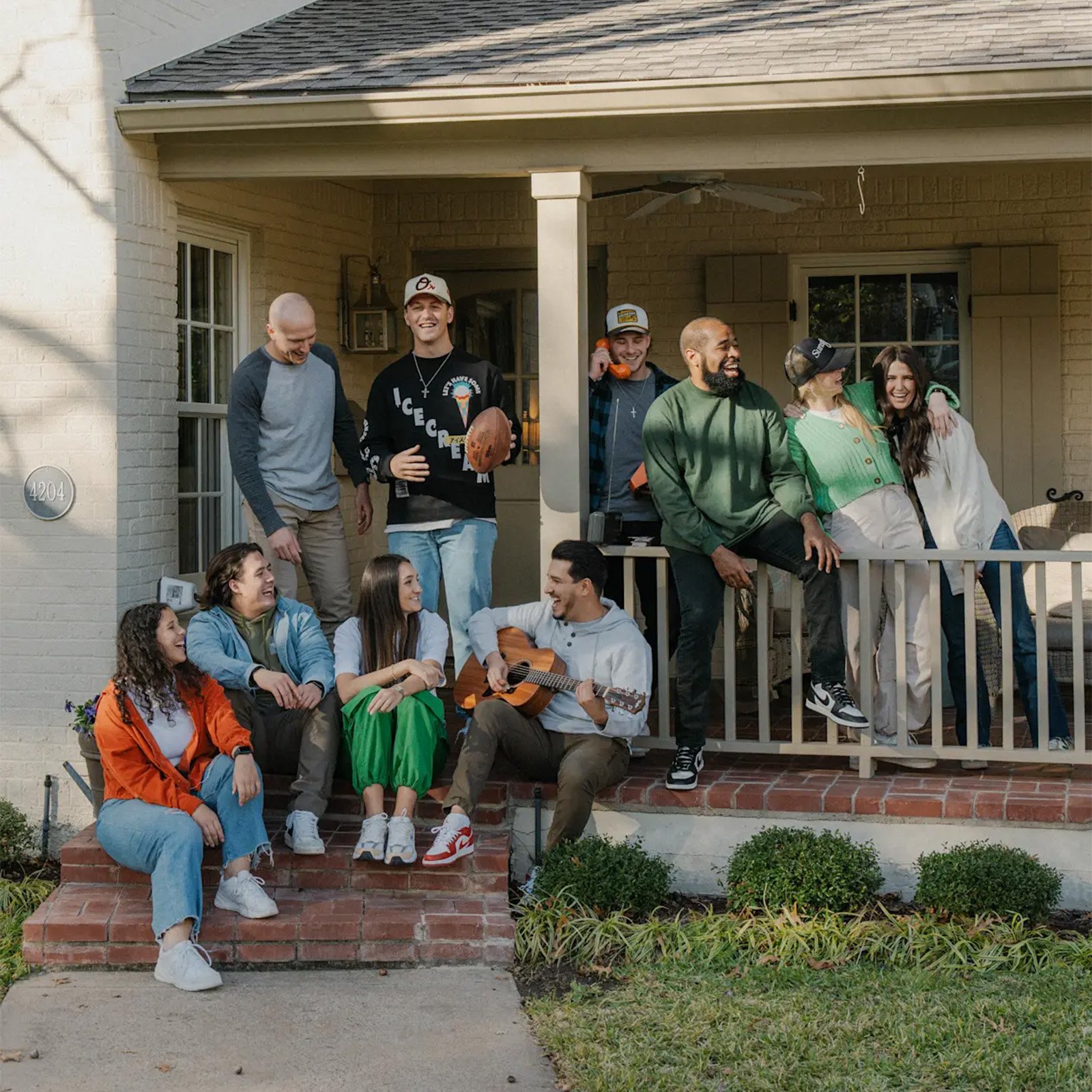 Young adults on a porch in Dallas, TX