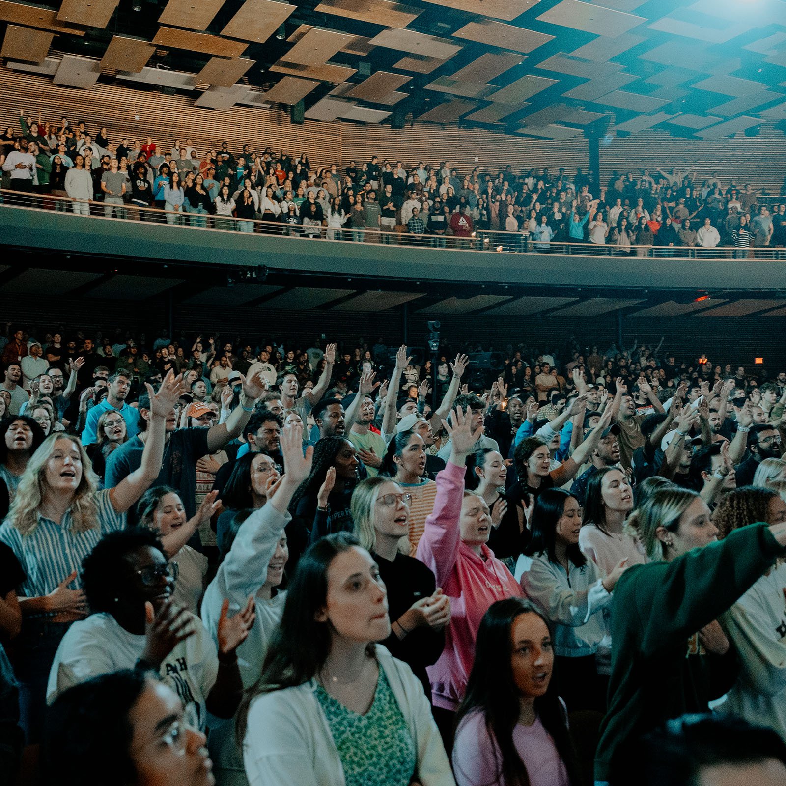 Young adults worshiping at Watermark Community Church