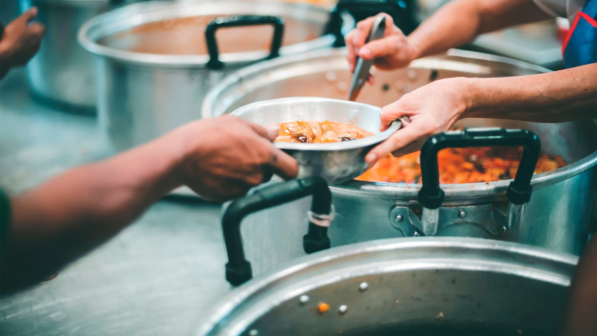 People in a food pantry giving out a meal