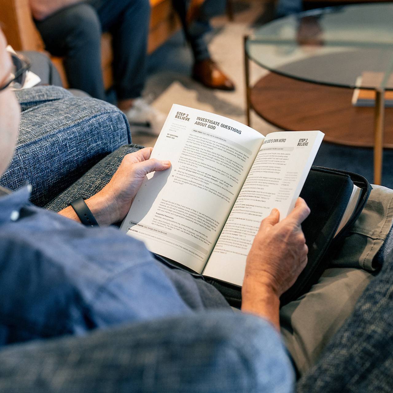 man holding regeneration booklet