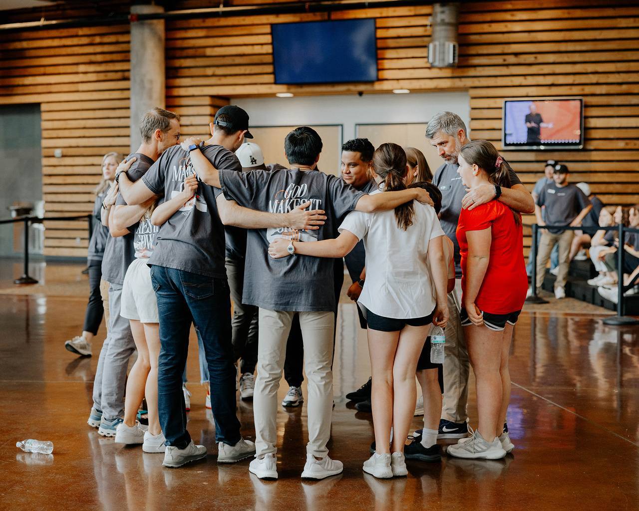 Watermark staff praying together at CLC