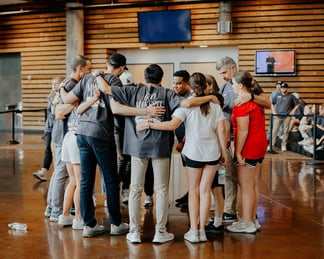 Watermark Community Church staff praying together