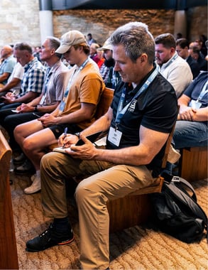 CLC attendee taking notes at Watermark Community Church