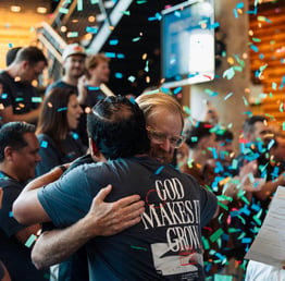 John Elmore hugging at CLC conference attendee