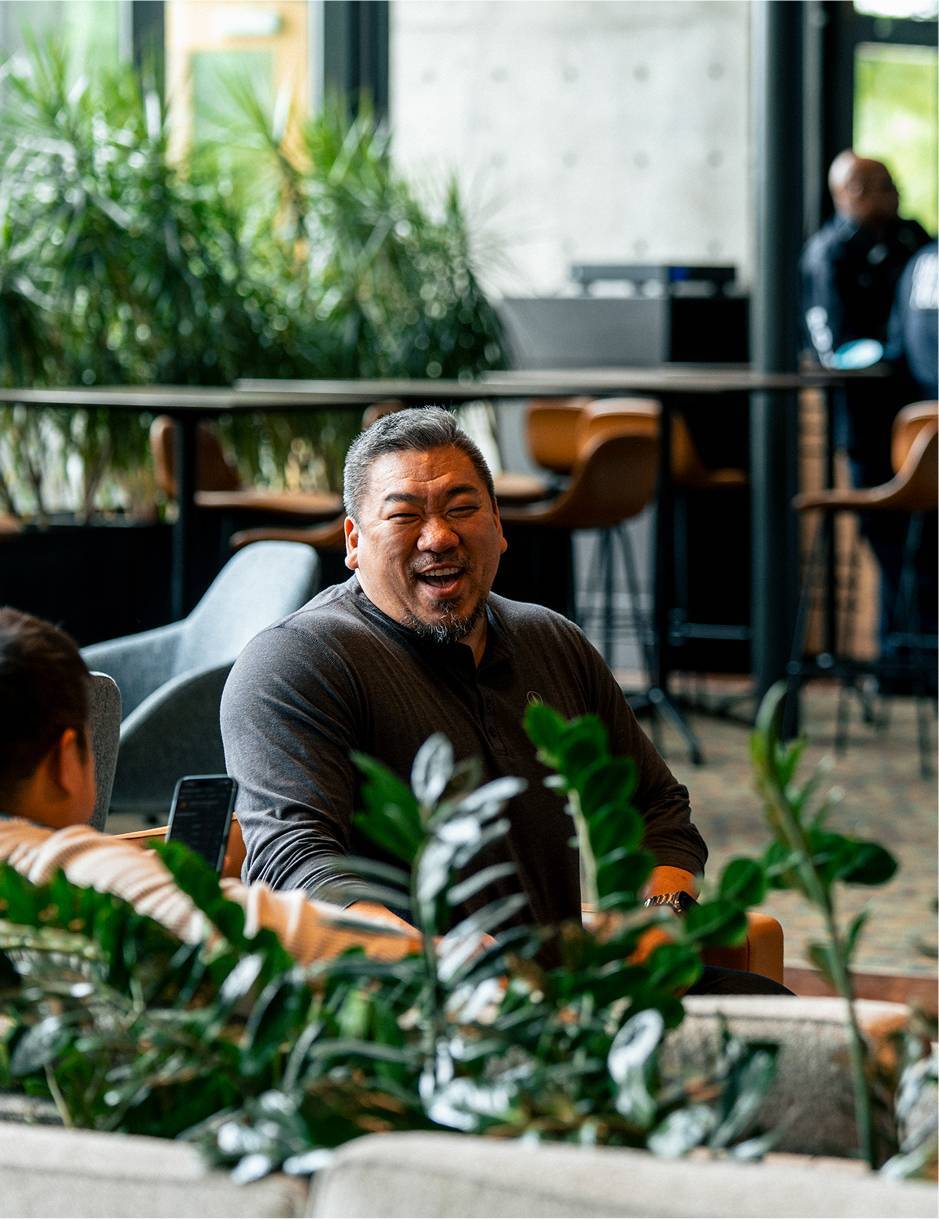 Man smiling at the Watermark Coffee shop in Dallas, TX