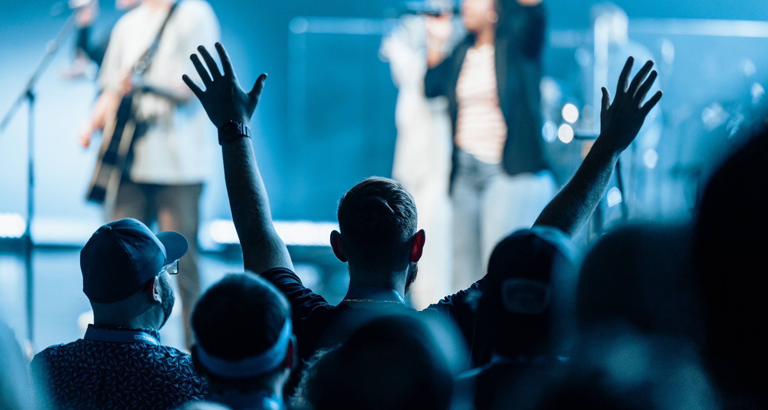 CLC attendee worshiping at Watermark Community Church
