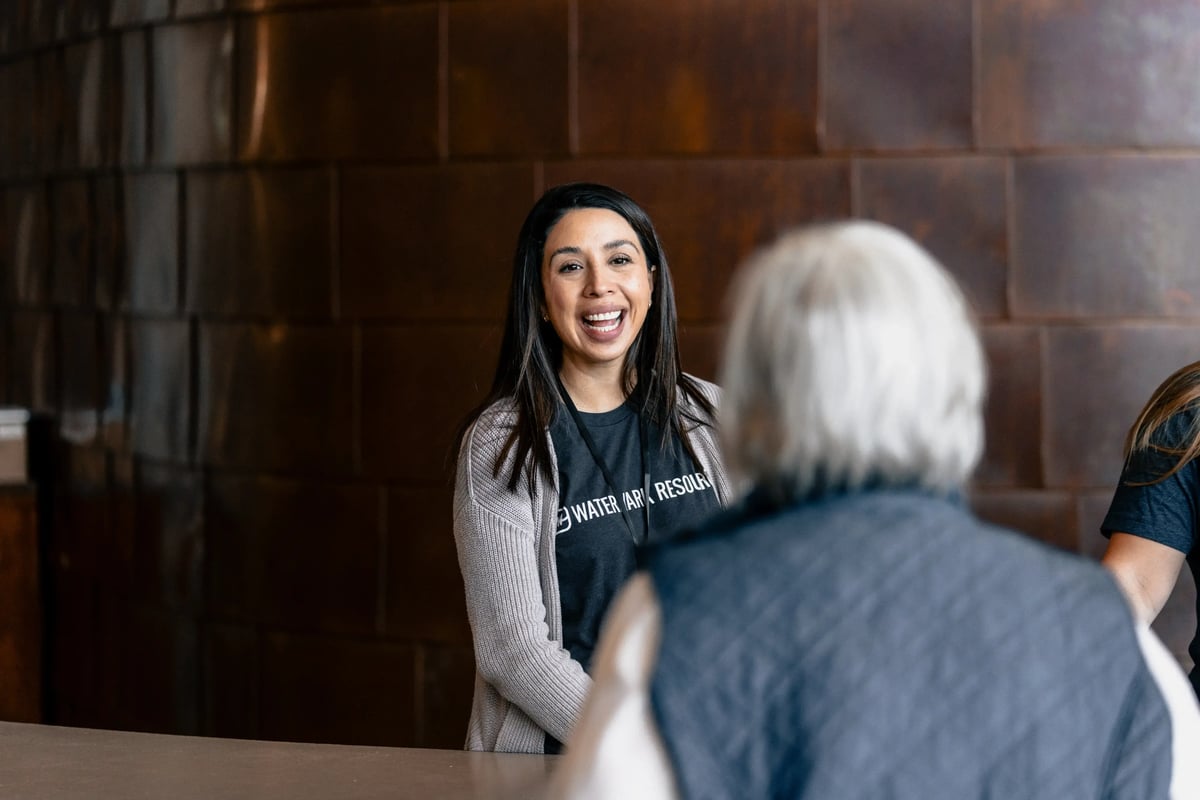 Watermark Resources team member helping conference goers